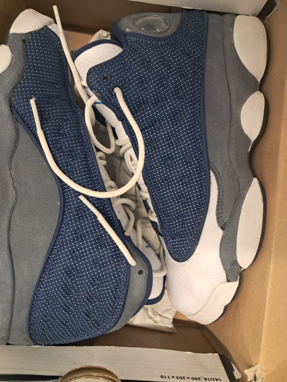 Jordan 13 Retro "Cool Blue" sneakers with blue perforated panels and white speck